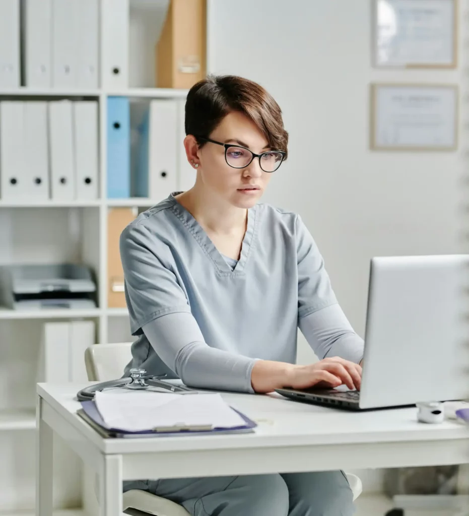 a person sitting at their laptop