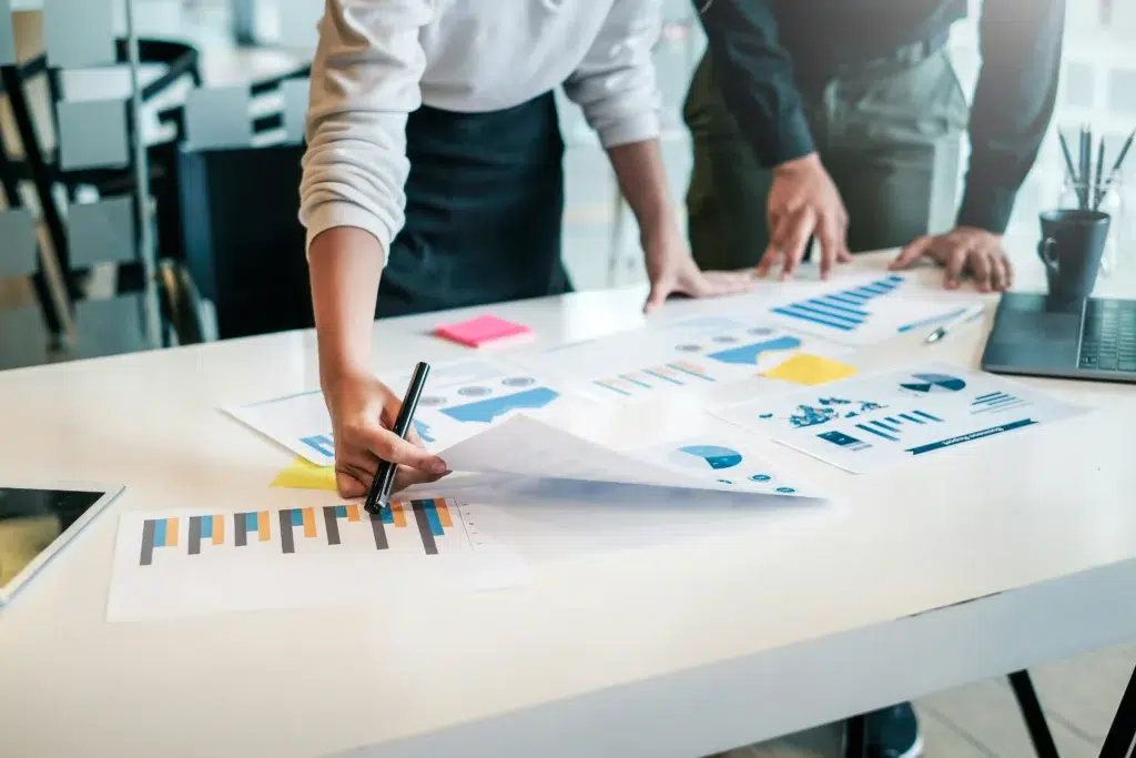 A person holding a chart with a marker in their hand